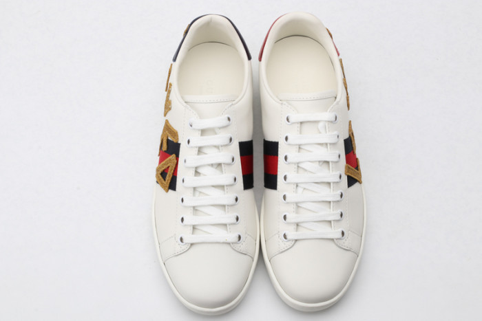 gu ace embroidered low-top sneaker